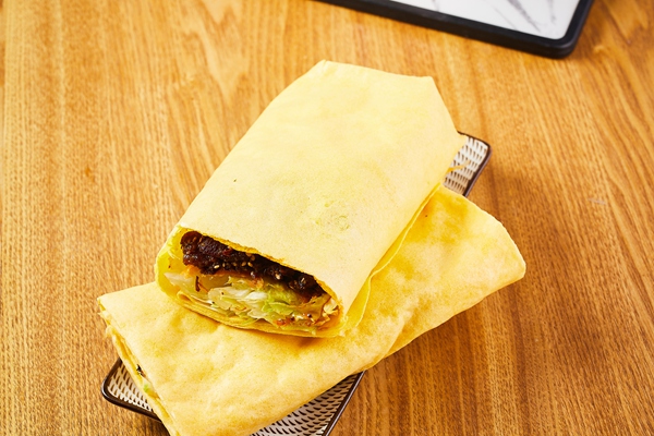 口留香煎饼果子加盟招商总部在哪？加盟口留香一年能挣多少？